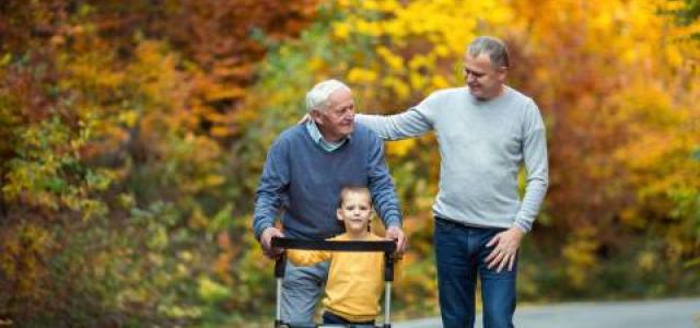 iStock-880854388 elderly father, son and grandson on walk